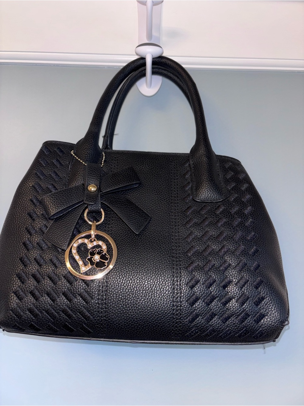 Black purse with sweet  metal accent